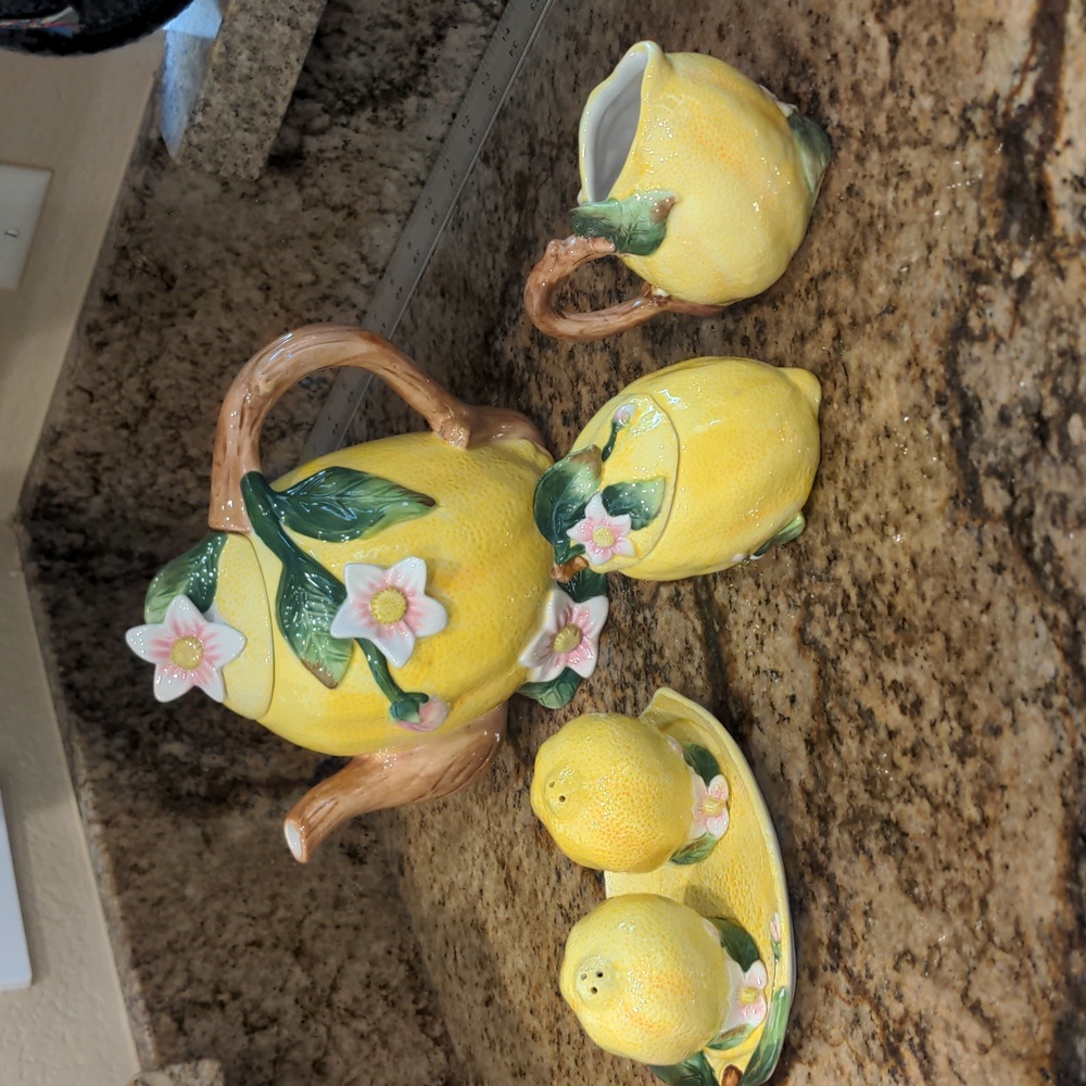 Lemon teapot with salt and pepper shakers and sugar and creamer